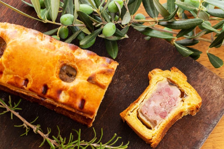 top view of a pate en croute or pâté en croûte with rosemary